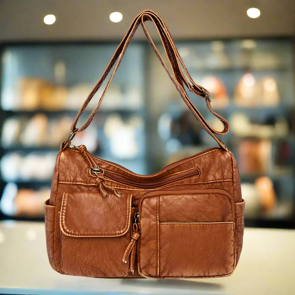 Lys | Vintage leather shoulder bag with several pockets