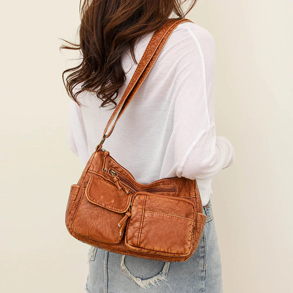 Lys | Vintage leather shoulder bag with several pockets